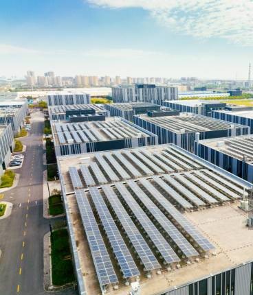 Aerial view of solar panels on factory roof